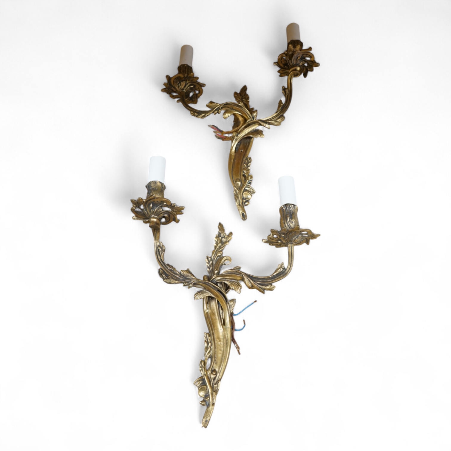 A pair of gilt metal two branch wall sconces, 37cm